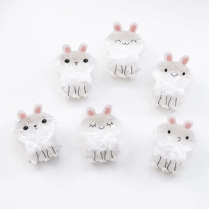 Set of six cute white bunny hair claws with marble texture and cartoon facial expressions