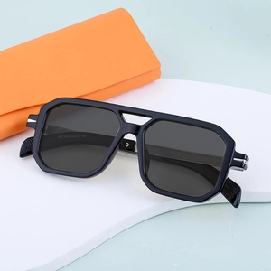 Polarized square sunglasses with black frame and grey lenses on blue background