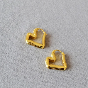 Elegant gold plated heart earrings with minimalist hollow design and polished finish