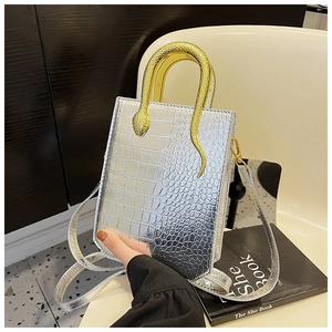 Detail of silver stone-pattern tote with a unique gold snake-shaped metal handle