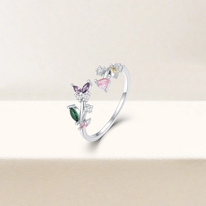 Detail of S925 silver adjustable ring with colorful heart-shaped gemstones