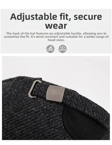 Détail de la boucle métallique réglable sur casquette en laine gris foncé pour homme