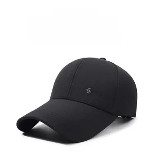 Detailed view of black baseball cap featuring an extended brim and silver S Fashion logo