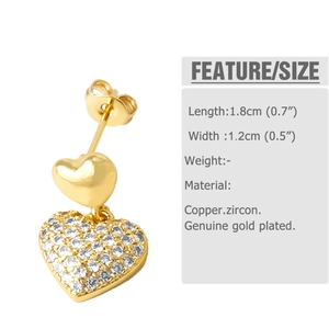 Detail view of gold heart earrings with white cubic zirconia and size specifications