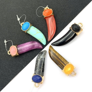 Selection of colorful resin tusk pendants with gold-tone clasps and inlaid crystals