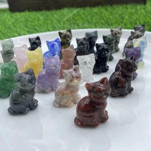 Group of assorted natural gemstone cats in rose quartz and amethyst on a white tray