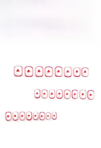French style press-on nails set with red gradient tips and tiny heart patterns