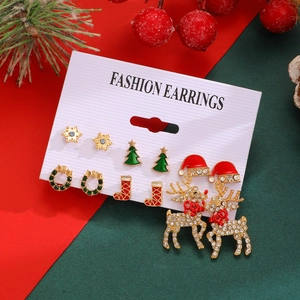 Detail of Christmas stud earrings set featuring Santa, Reindeer and festive patterns