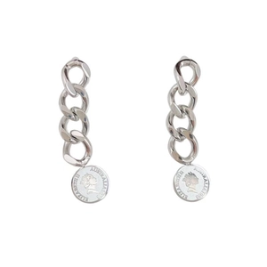 Detail of silver long chain earrings featuring a vintage coin pendant with Elizabeth II