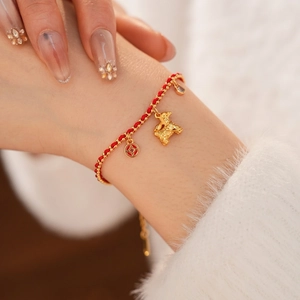 18K gold plated red rope bracelet featuring a pig charm and lucky coin pendant