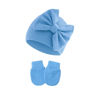 Detailed view of sky blue baby knit hat with large bow and matching anti-scratch mittens