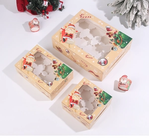 Detail of festive cupcake boxes with clear windows and Christmas themed patterns