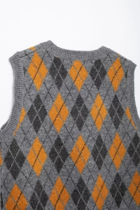 Detailed back view of vintage argyle knit vest in grey and orange diamond pattern