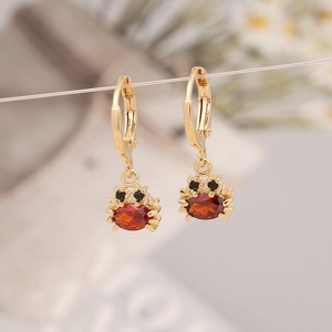 Chic golden crab earrings with red oval zircon stones and secure hoop closures