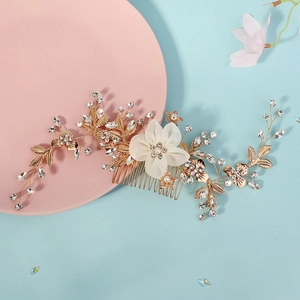 Exquisite bridal hair comb with gold metal, faux white flower, pearls and rhinestones