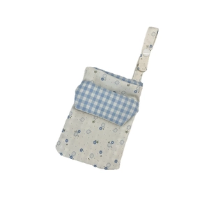Floral canvas nurse pocket organizer with blue gingham flap and snap button strap