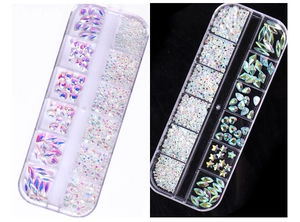 Macro shot of 12-grid storage box with assorted AB crystal nail art rhinestones and gems