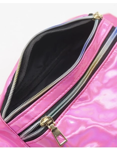 Detail of pink holographic waist bag featuring dual gold metal zippers and internal pocket