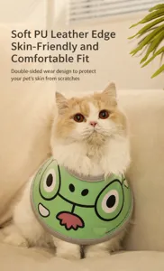 Close-up of green frog cartoon pet collar with soft PU leather edges and reversible design