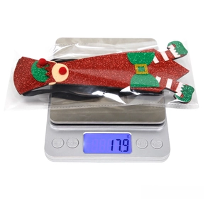 Detailed weight display showing a 17.9g sequined Christmas elf boot tie on a digital scale