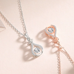 Elegant water drop crown necklaces in silver and rose gold with dancing zircon stones