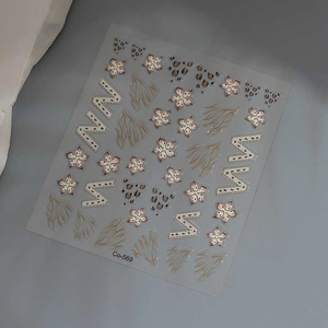 Detail of Co-569 nail stickers featuring leopard print, hibiscus, and letter M motifs