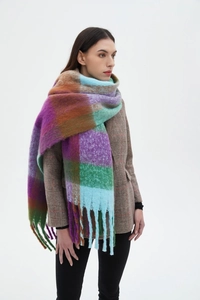 Close-up of thick checkered bouclé scarf with colorful fringe detail and fuzzy texture