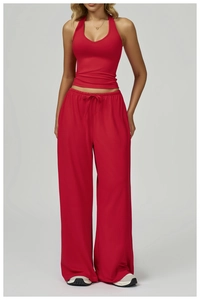 Red two-piece yoga set featuring a halter crop top and high-waisted wide-leg gym trousers