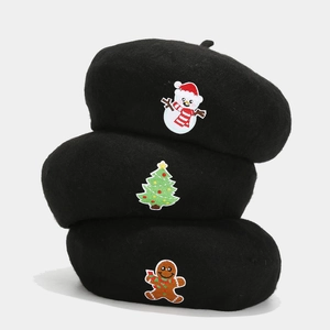 Three black wool berets with Christmas embroidery featuring snowman and tree motifs
