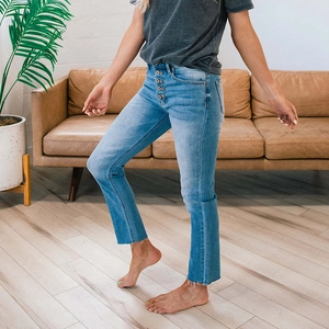Women's high waist straight leg denim jeans in blue with a button fly and raw hem details