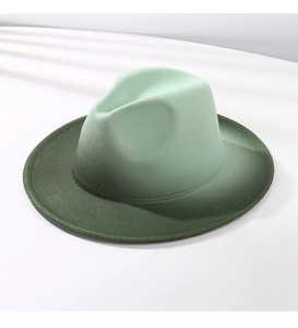 Detailed close-up of the smooth green gradient transition on the wool felt fedora hat