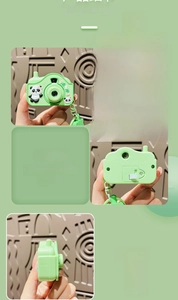 Detail view of the green panda camera keychain showing front and back functional parts