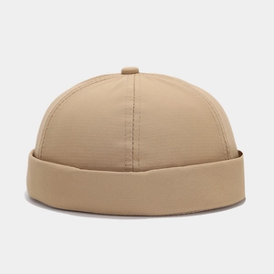 Detail of khaki quick-dry docker cap featuring textured fabric and neat stitching