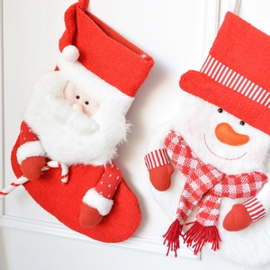 Thick knitted Christmas stockings featuring 3D plush Santa Claus and Snowman designs