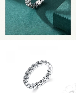 Detailed macro view of S925 sterling silver leaf ring with micro-pave zircon crystals