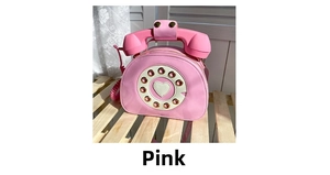 Close-up of pink retro telephone shaped handbag with vintage dial and heart detail