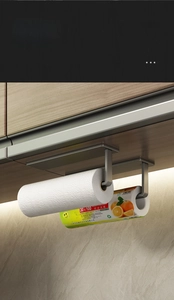 Detail of gunmetal grey kitchen paper towel rack with dual rolls and adhesive mounting