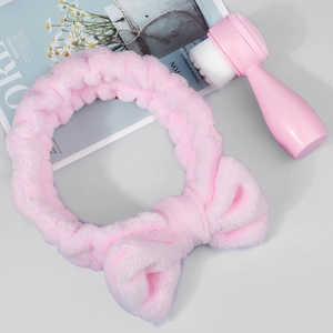 Pink silicone face brush set with soft microfiber bristles and a coral fleece bow headband