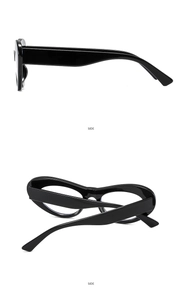 Side view of black thick-frame cat-eye glasses with wide glossy temples on white background
