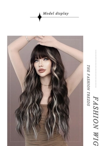 Detail showing long wavy synthetic wig in dark brown with ash blonde highlights and airy bangs