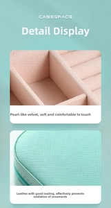 Detail of mint green leather jewelry box with soft pink velvet lining and airtight seal