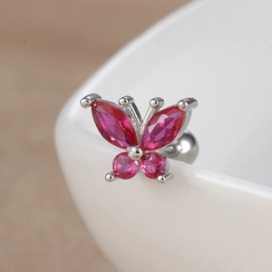 Macro detail of butterfly ear stud with pink zircon gemstones and screw back closure