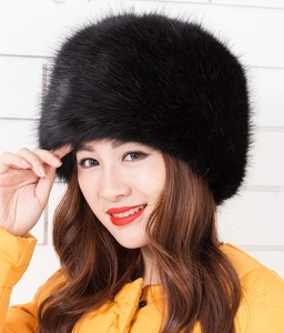 Detail showing the thick black faux fox fur texture and thermal lining of the Russian hat
