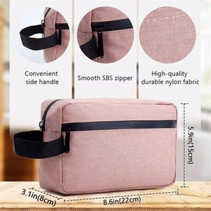 Pink waterproof nylon toiletry bag detail showing sturdy handle and SBS zipper components