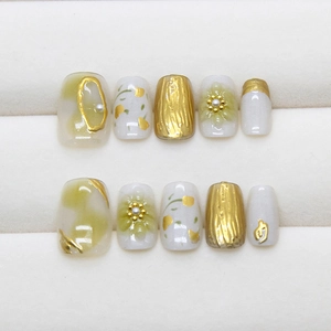 Handmade press-on nails with olive green marble, 3D floral accents, and pearl details