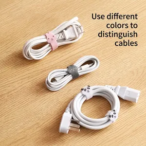 Animal shaped velcro cable ties for cord management on a wooden desk setting