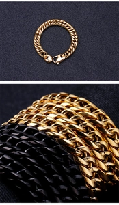 Close-up of gold and black stainless steel Cuban link bracelets on a dark surface