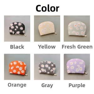 Detailed grid of daisy print coin purses in six colors with pebbled PU leather texture