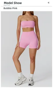 Detail of high-waisted yoga shorts and ribbed crop top in bubble pink athletic fabric