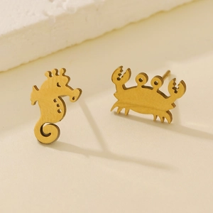 Golden stainless steel crab and seahorse stud earrings with a minimalist animal design